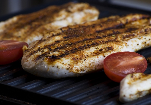 Juicy and succulent chicken breast on the barbecue